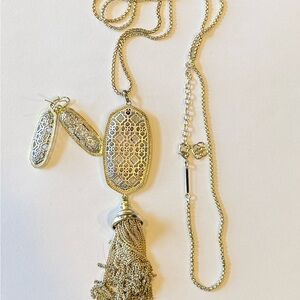 Kendra Scott drop mixed metal earrings.